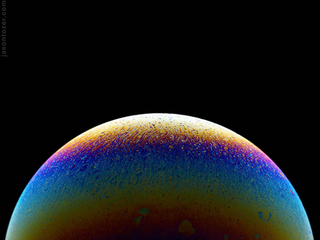 Illustration for article titled Photos of Soap Bubbles that Look Like Trippy Exoplanets